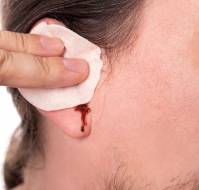 What should be done if there is bleeding from the ear?