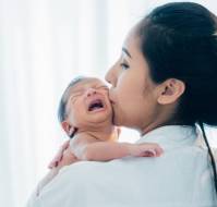 If my child becomes very cranky because of a nasal allergy, how can I help him cope with the nose block and discomfort?